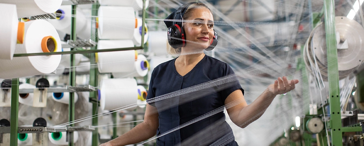 Woman employee in thread manufacturing