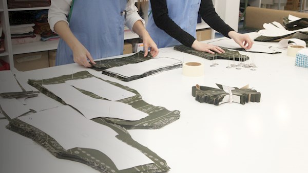 Cutting cloth in design studio