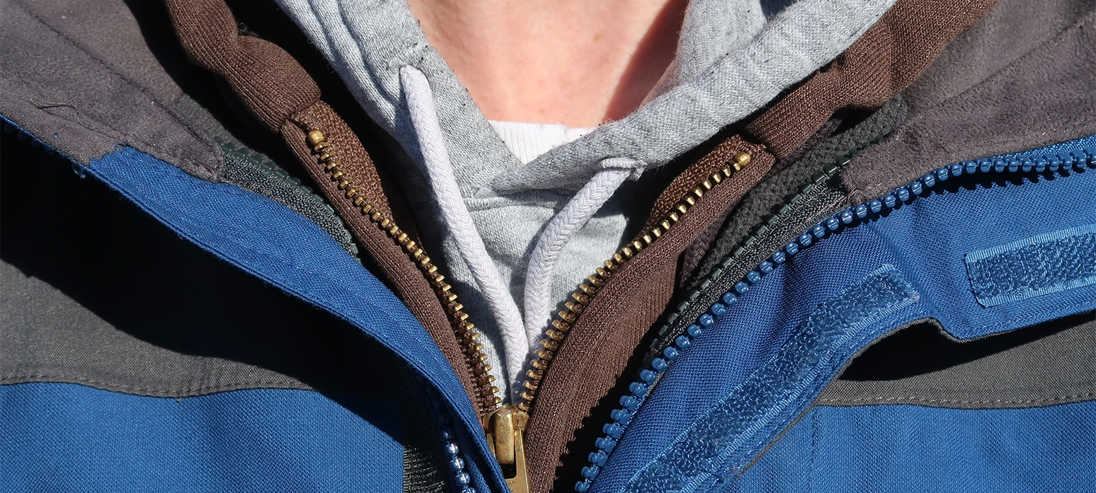 Apparel jacket with hook and loop fastener