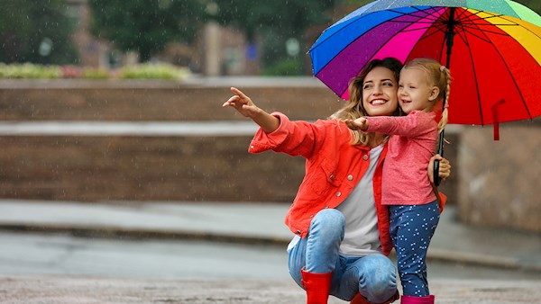 Mother-daughter holding an umbrella