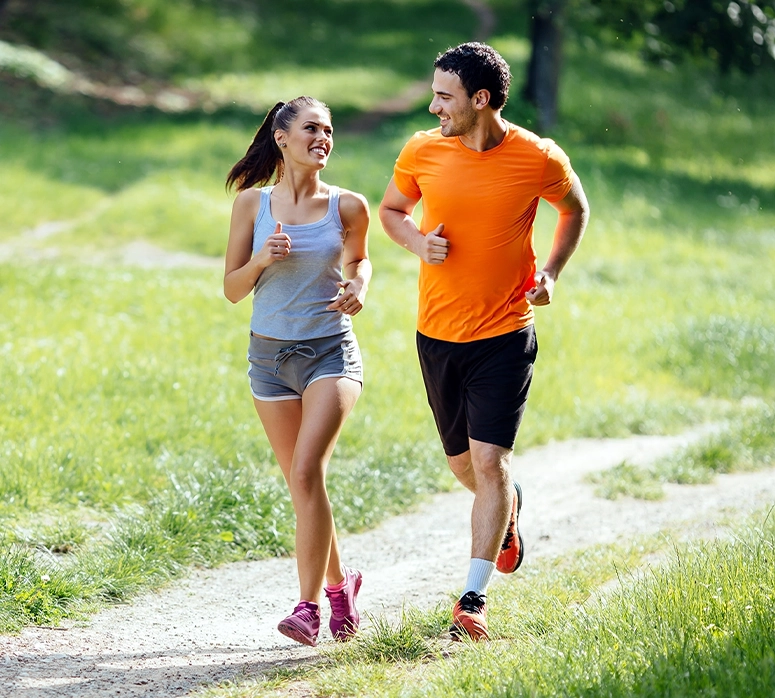 A woman and man are jogging